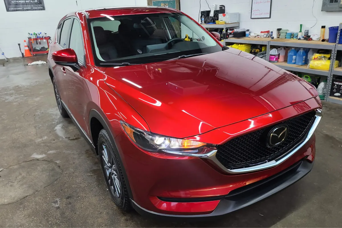 Clean red car with polished exterior in the garage