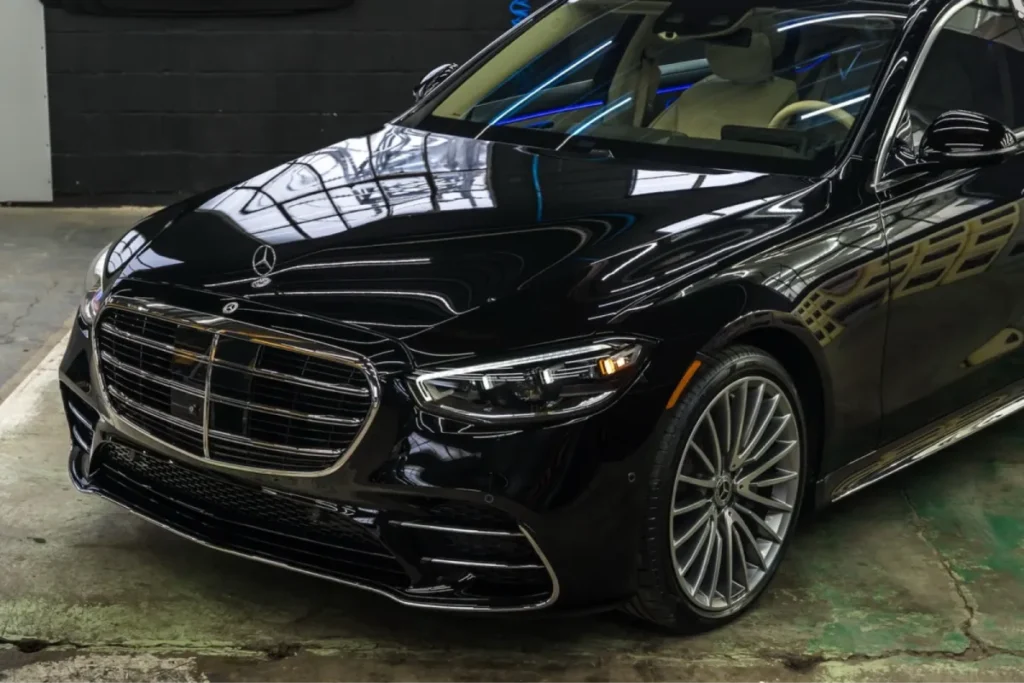 Black Mercedes sedan with glossy ceramic coating finish.