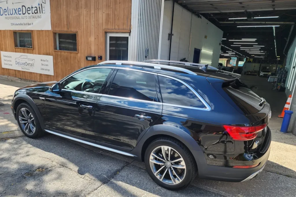 Paint protection film installed on a black Audi SUV, enhancing gloss and protecting the paint.