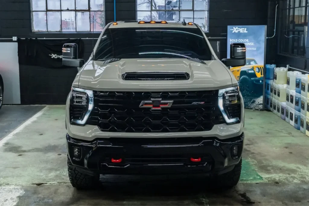 Front view of a Chevrolet truck with tinted windows.